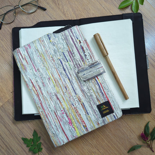 recharkha upcycled handwoven executive diary cover handmade from waste plastic bags, cassette tapes and gift wrappers from India 