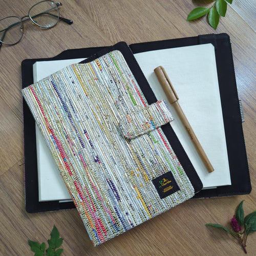 recharkha upcycled handwoven executive diary cover handmade from waste plastic bags, cassette tapes and gift wrappers from India