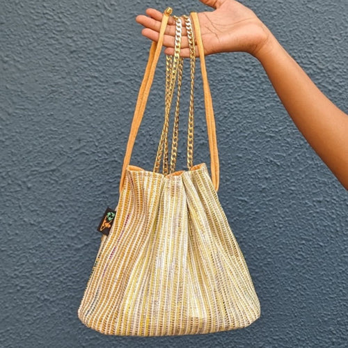 Golden And White Striped Shimmery Waste Plastic Wrappers Upcycled Handwoven Girija Potli Sling (GP0424-002)