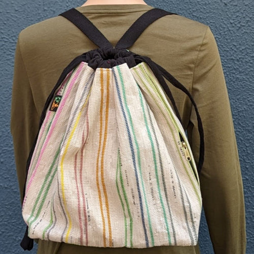 (NLBP0424-005) White Waste Plastic Wrappers with Multicolored Stripes Upcycled Handwoven Light Backpack