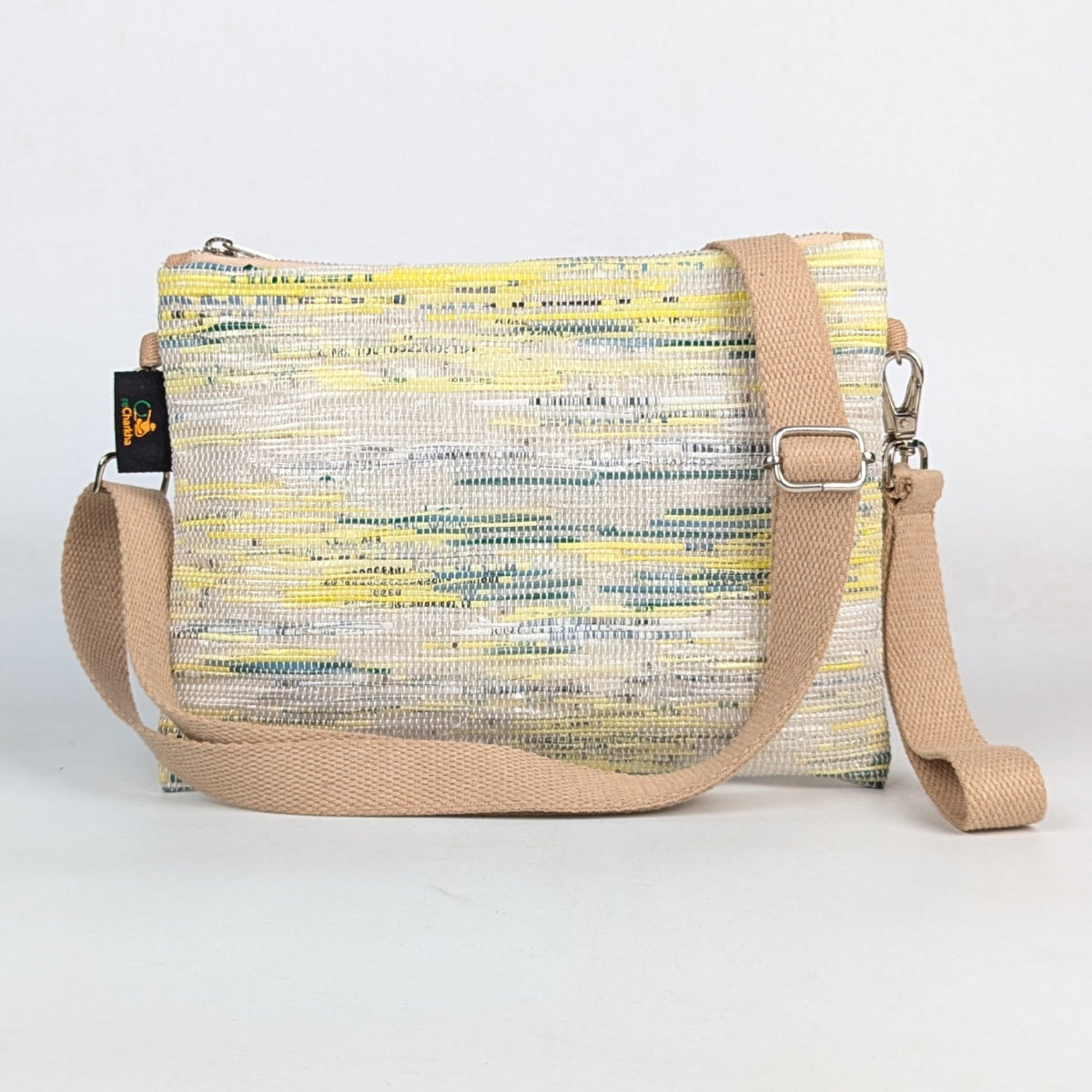 Crossbody bag with a colorful pattern on a white background
